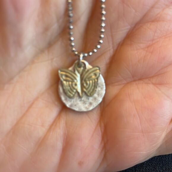 Gold butterfly pendant necklace with round silver pendant that says “Imagine” - Picture 3 of 5